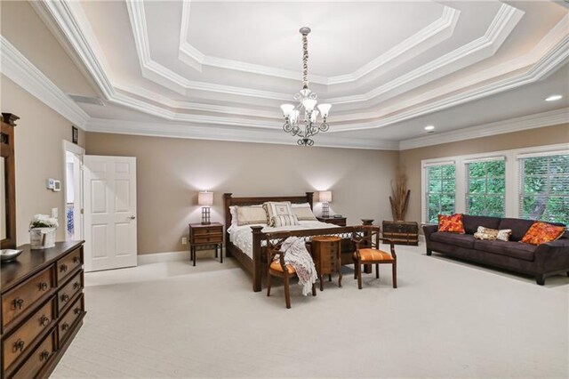 carpeted bedroom featuring ornamental molding, a chandelier, and a raised ceiling