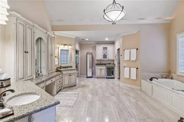 bathroom with a tub to relax in, vanity, beverage cooler, and crown molding