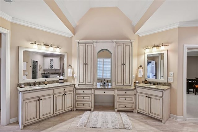 bathroom featuring high vaulted ceiling, tile patterned floors, and vanity