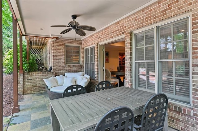 view of patio featuring ceiling fan