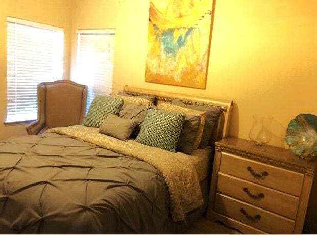 6265 Lake Windsor Pkwy, Buford, GA 30518 - bedroom featuring multiple windows