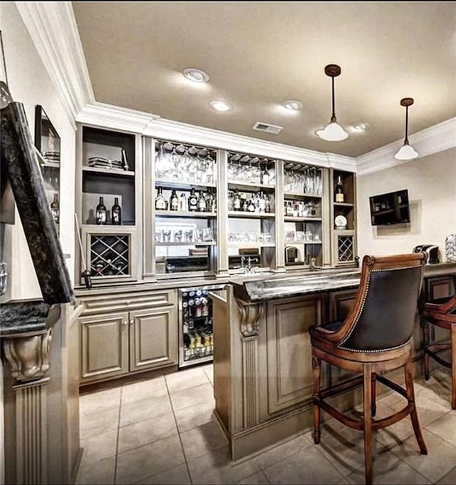 6265 Lake Windsor Pkwy, Buford, GA 30518 - indoor dry bar featuring crown molding, wine cooler, pendant lighting, light tile patterned flooring, and built in shelves