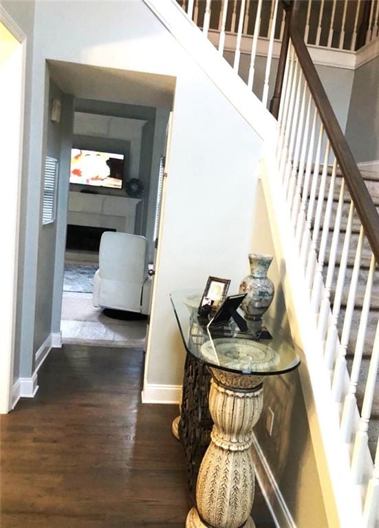 6265 Lake Windsor Pkwy, Buford, GA 30518 - staircase featuring wood finished floors and a fireplace