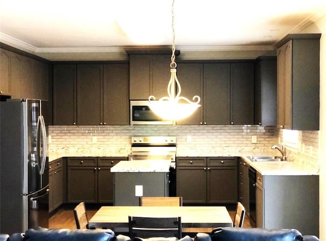 6265 Lake Windsor Pkwy, Buford, GA 30518 - kitchen with appliances with stainless steel finishes, ornamental molding, light countertops, decorative backsplash, and hanging light fixtures