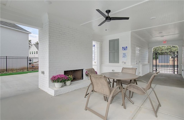3338 Cranston Ln, Kennesaw, GA 30144 - view of patio / terrace featuring an outdoor brick fireplace, ceiling fan, and outdoor dining area