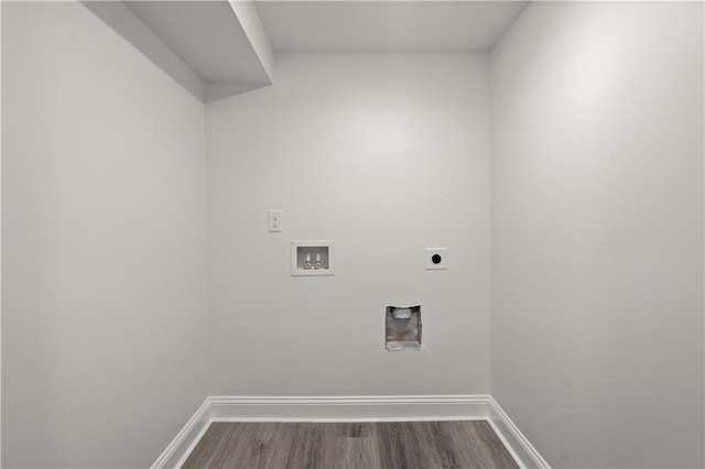 laundry room featuring washer hookup, laundry area, baseboards, electric dryer hookup, and dark wood-type flooring