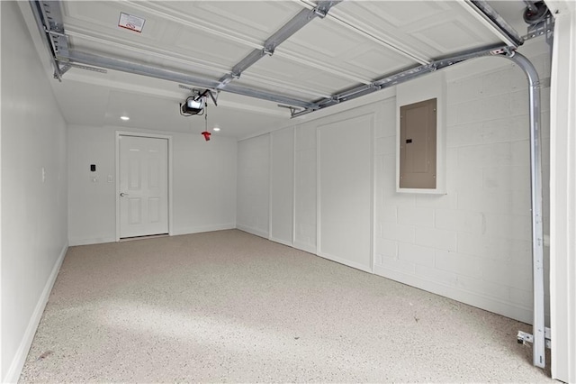 garage with concrete block wall, a garage door opener, and electric panel