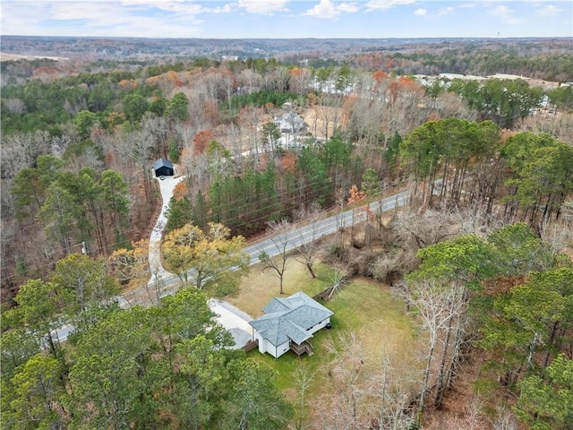 bird's eye view featuring a wooded view
