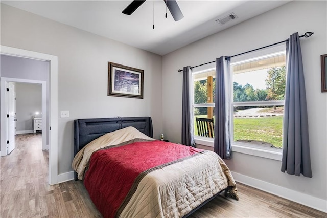 bedroom featuring hardwood / wood-style floors and ceiling fan