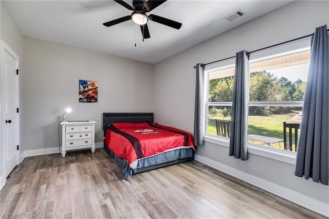 bedroom featuring ceiling fan and light wood-type flooring