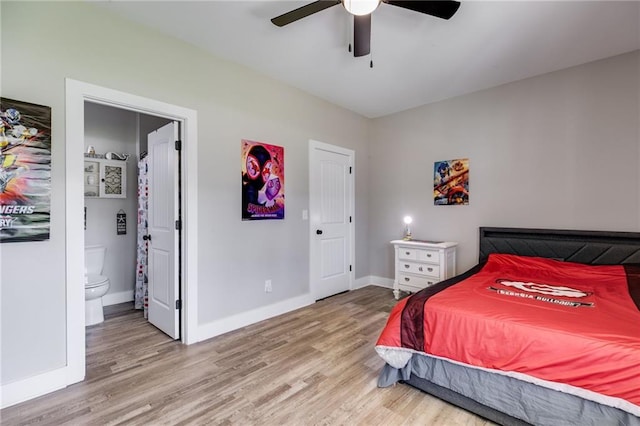 bedroom featuring connected bathroom, wood-type flooring, and ceiling fan