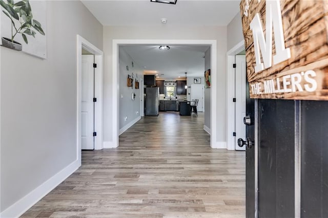 hallway featuring wood-type flooring