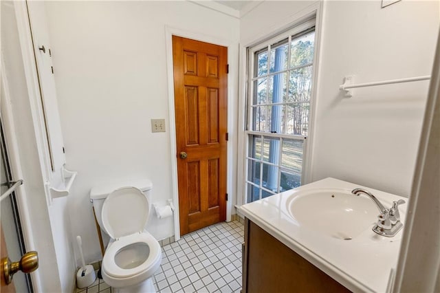 bathroom with vanity, tile patterned flooring, and toilet