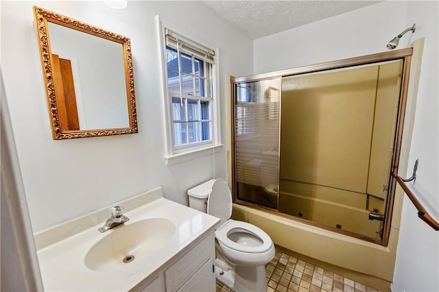 full bathroom with vanity, a textured ceiling, shower / bath combination with glass door, and toilet