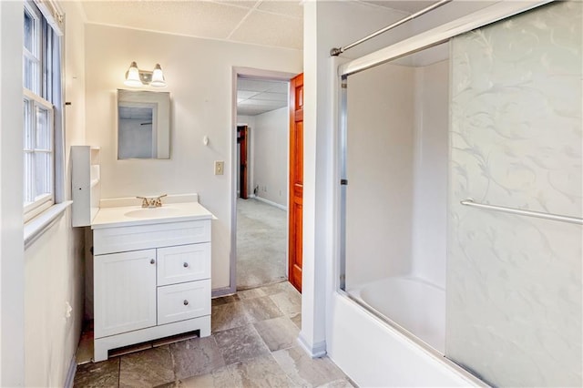 bathroom featuring vanity and shower / bath combination with glass door