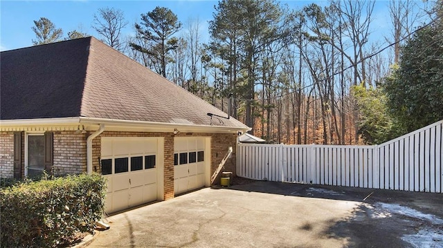 view of side of property featuring a garage