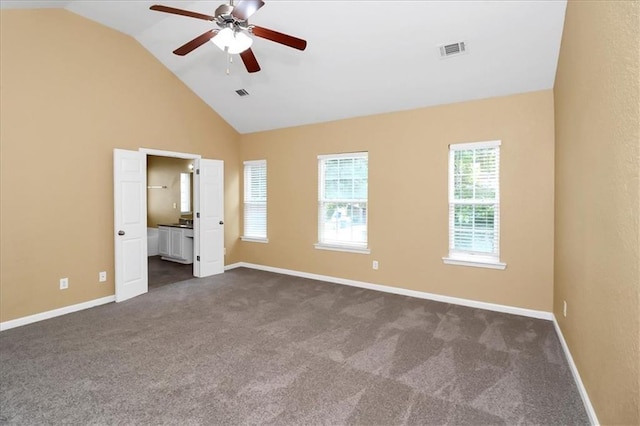 unfurnished bedroom featuring visible vents, high vaulted ceiling, baseboards, and dark colored carpet