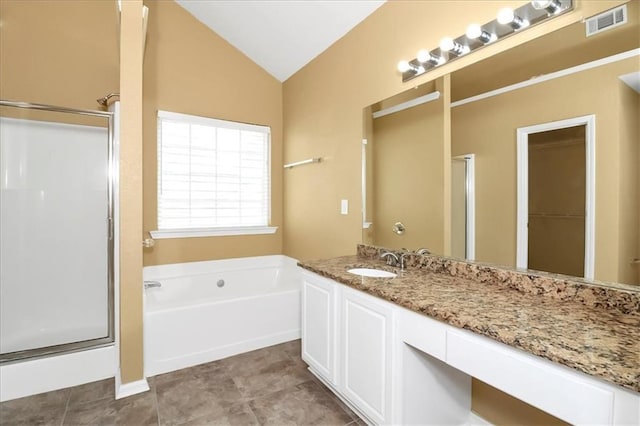 full bathroom featuring lofted ceiling, a bath, visible vents, and a stall shower