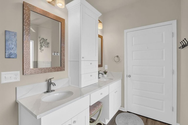 bathroom featuring double vanity and washer / clothes dryer