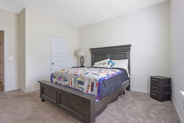carpeted bedroom with baseboards