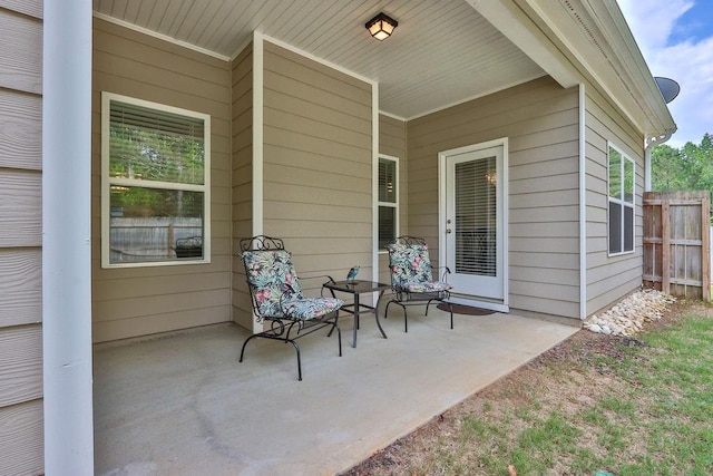 view of patio featuring fence