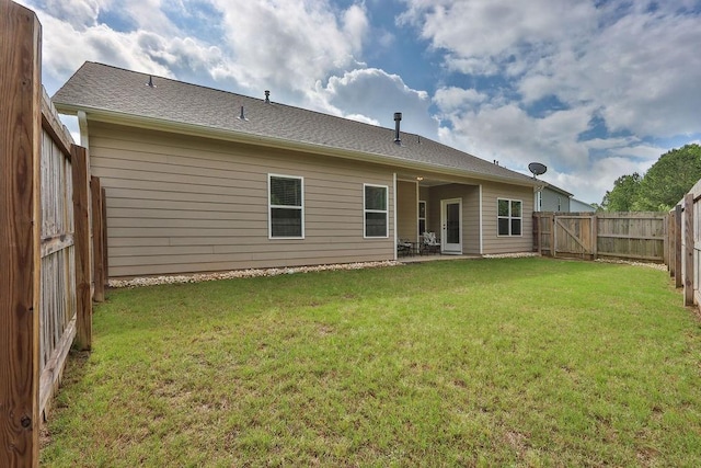 back of property with a patio