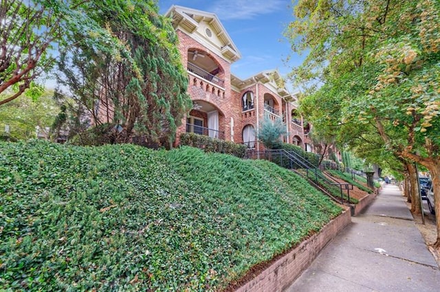 view of front of home featuring brick siding