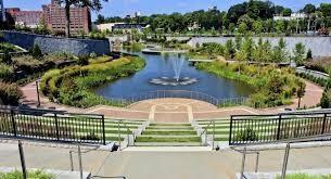 surrounding community featuring a water view and fence