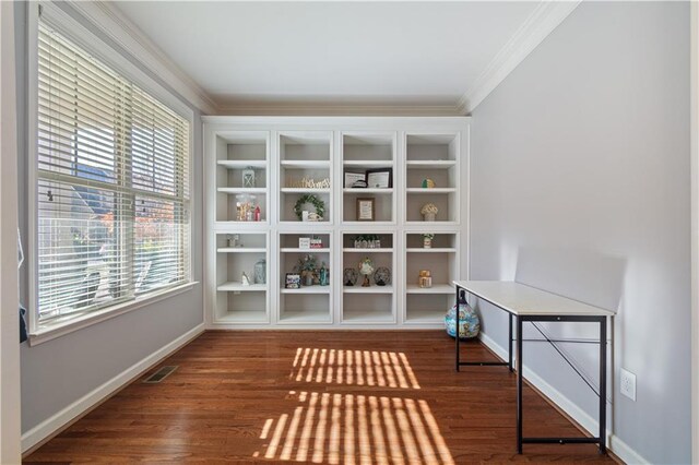 unfurnished room with crown molding, dark hardwood / wood-style flooring, and a healthy amount of sunlight