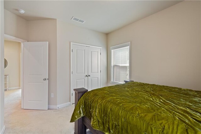 carpeted bedroom featuring a closet