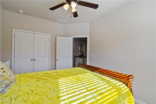 unfurnished bedroom with a closet and ceiling fan