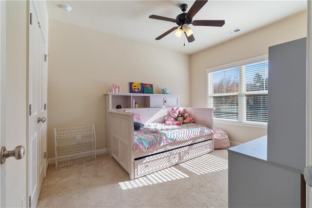 bedroom featuring ceiling fan and light colored carpet