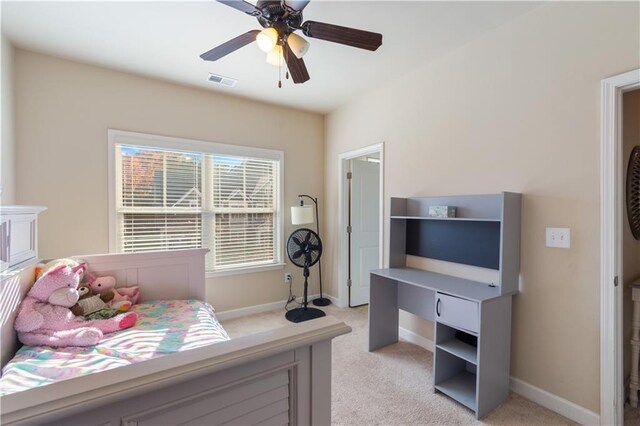 bedroom with ceiling fan and light colored carpet