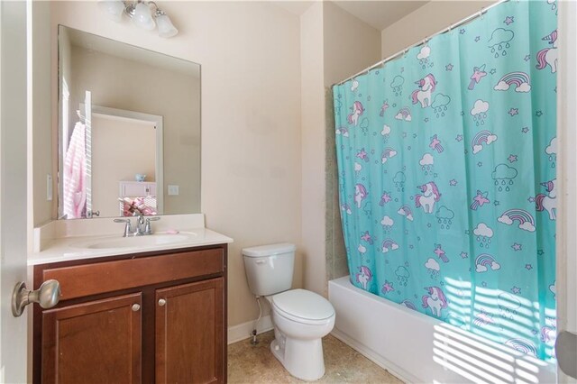 full bathroom with tile patterned floors, vanity, toilet, and shower / tub combo with curtain