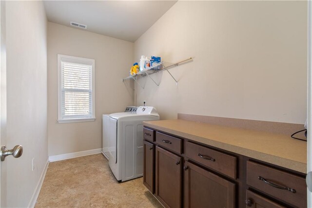 washroom with washer and dryer