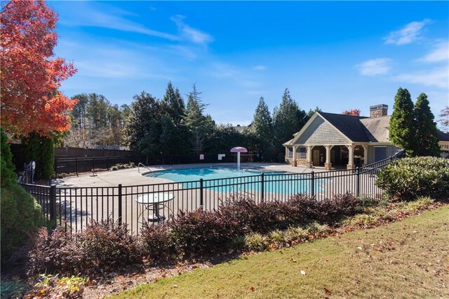 view of swimming pool featuring a patio