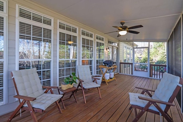 sunroom / solarium with ceiling fan