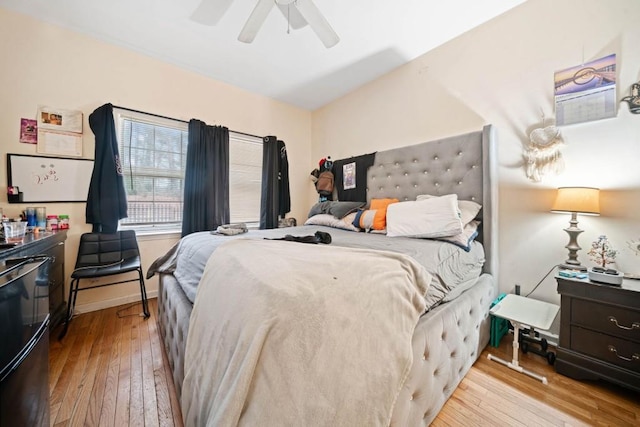 bedroom featuring a ceiling fan and hardwood / wood-style flooring