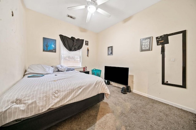 carpeted bedroom featuring baseboards, visible vents, and ceiling fan