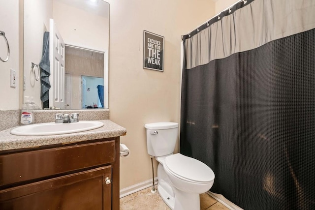 bathroom with tile patterned floors, toilet, curtained shower, and vanity