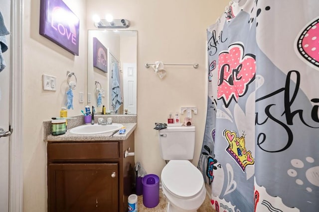 bathroom with vanity, toilet, and a shower with curtain