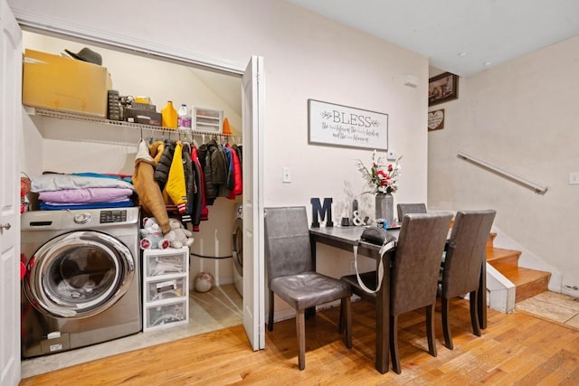 laundry room featuring washer / dryer and wood finished floors