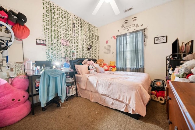 carpeted bedroom with vaulted ceiling, a ceiling fan, and visible vents