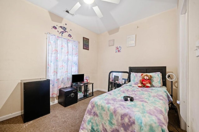 carpeted bedroom featuring baseboards and a ceiling fan