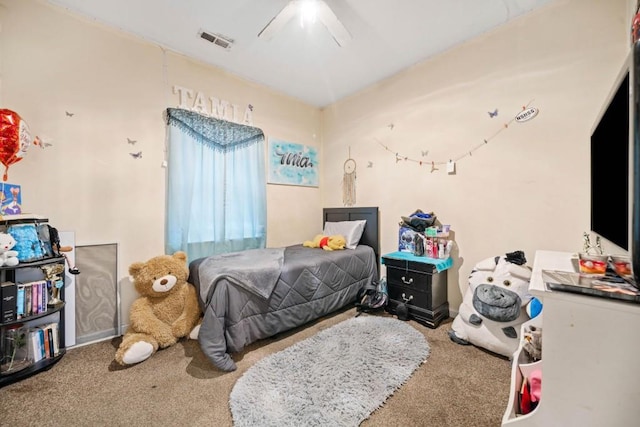 bedroom with visible vents, carpet floors, and ceiling fan