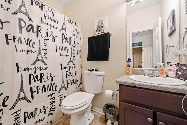 bathroom with tile patterned floors, a shower with curtain, toilet, baseboards, and vanity