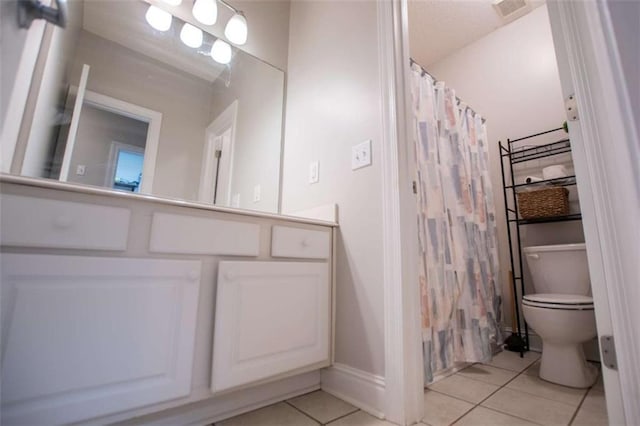 full bath featuring visible vents, curtained shower, toilet, tile patterned floors, and vanity