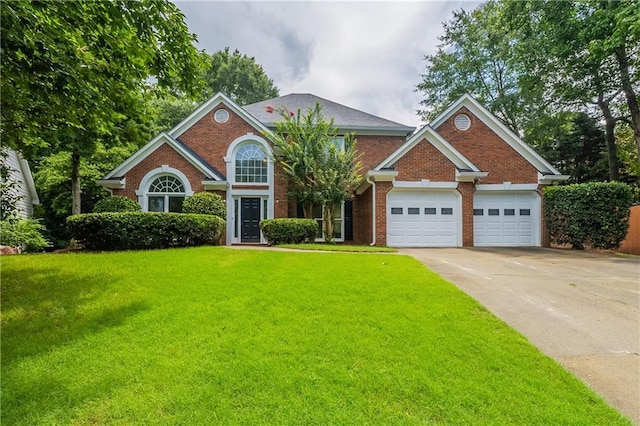 3807 Lance Bluff Ct, Duluth, GA 30097 - view of front of property with an attached garage, brick siding, a front lawn, and concrete driveway