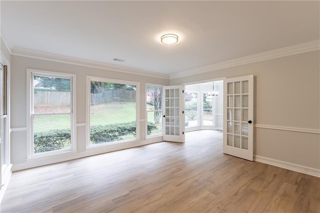 3807 Lance Bluff Ct, Duluth, GA 30097 - empty room featuring crown molding, a chandelier, light wood finished floors, and plenty of natural light