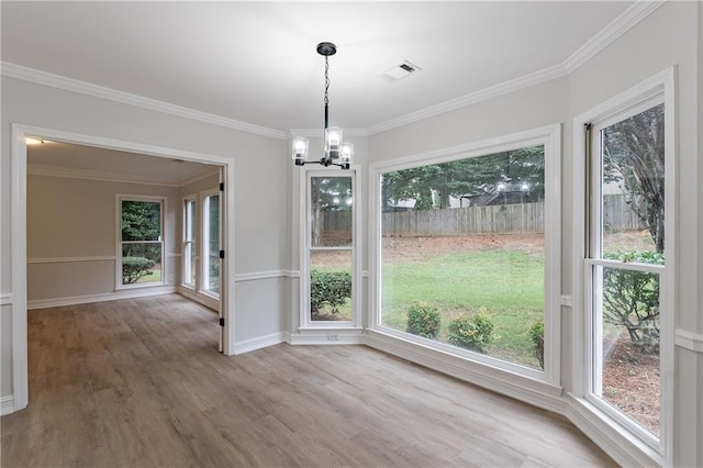 3807 Lance Bluff Ct, Duluth, GA 30097 - unfurnished dining area featuring a chandelier, wood finished floors, plenty of natural light, and ornamental molding